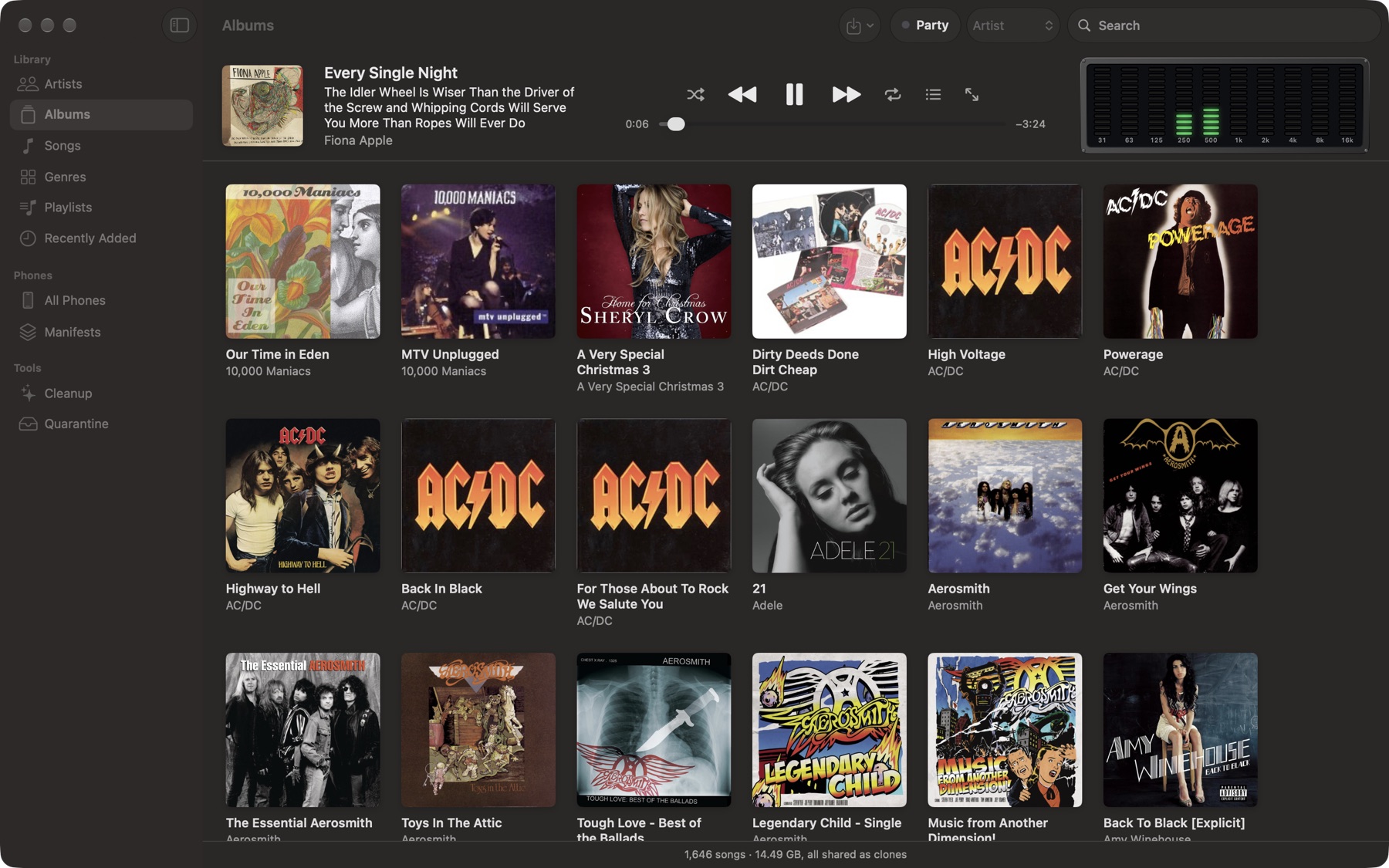 Müsick on the Mac: an album grid under a Now Playing strip with the full album title and a ten-band spectrum analyzer