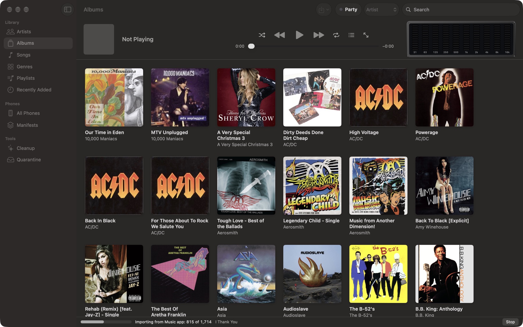 Importing from the Music app: 815 of 1,714 songs, album art appearing as they arrive